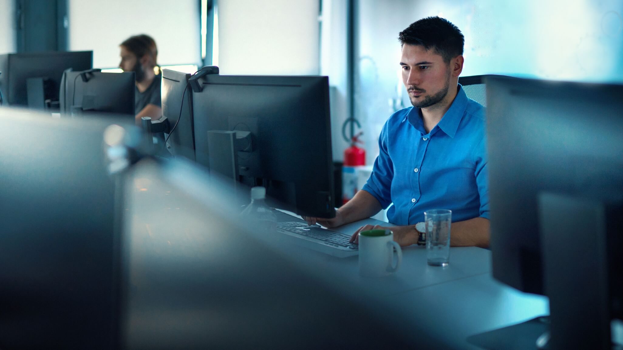 people working in office on computers